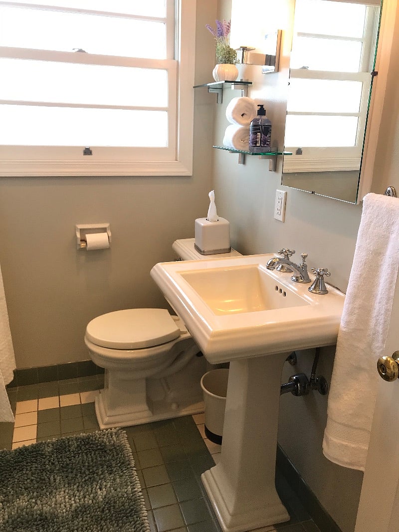 Bath with shower over full size tub and storage closet