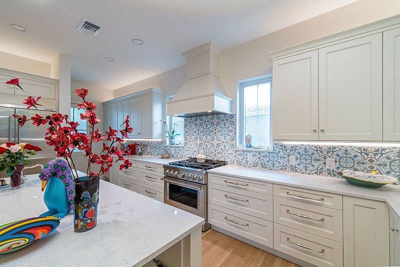 Gas range which chef's prefer. Back door to yet another seating space, private and has an herb garden. Pantry with extra plenty of storage for all.