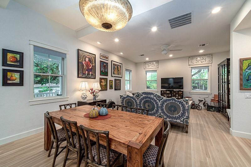 Flex Living, Kitchen. Dining. Gorgeous original art, beautiful hardwood floors, top of the line appliances. Custom pecan table to fit the space.