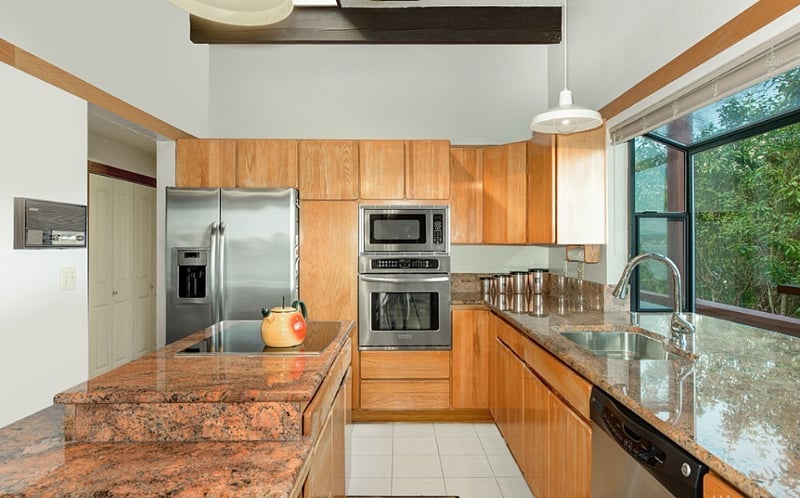 Kitchen is fully stocked with table ware, small appliances and linens.