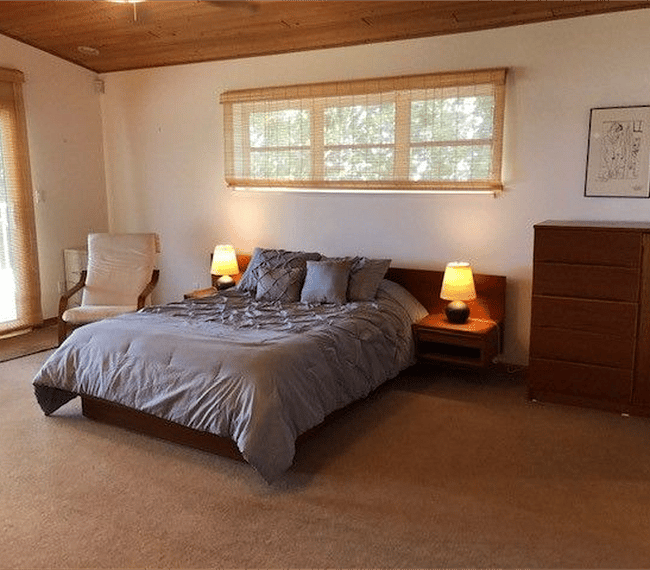 Teak furniture, including armoire and bed.