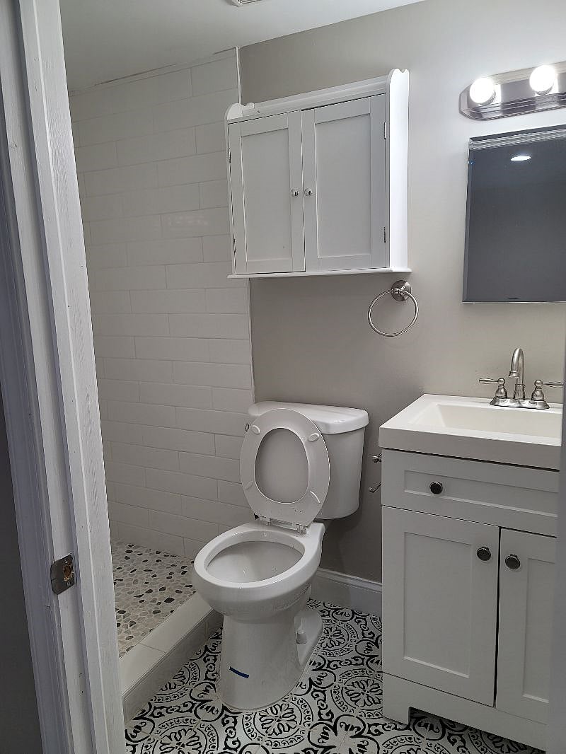 Room 0, basement bathroom with white tones