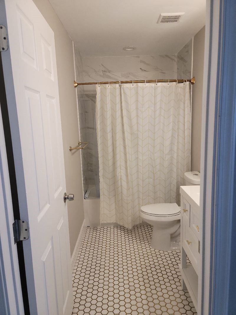 Room 2 bathroom with gold tone fixtures, $1450 for this room