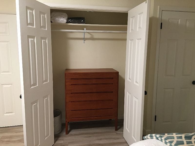 Dresser in closet with space for hanging clothing on either side or we can move the dresser out, into space near bathroom door.