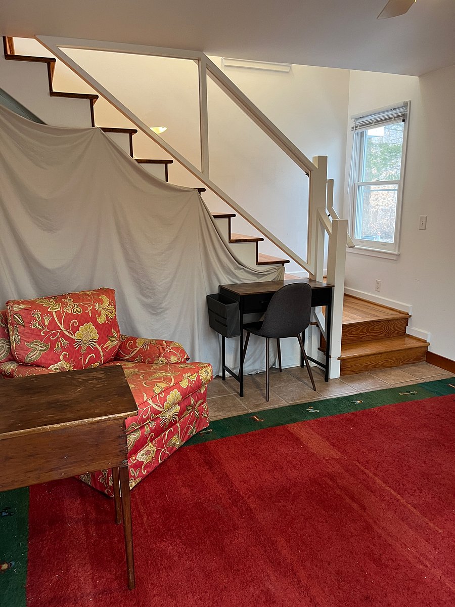Upon entering, downstairs room. Owner storage is behind the curtain.
