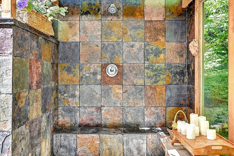 Outdoor shower with privacy wall and windows with a view!