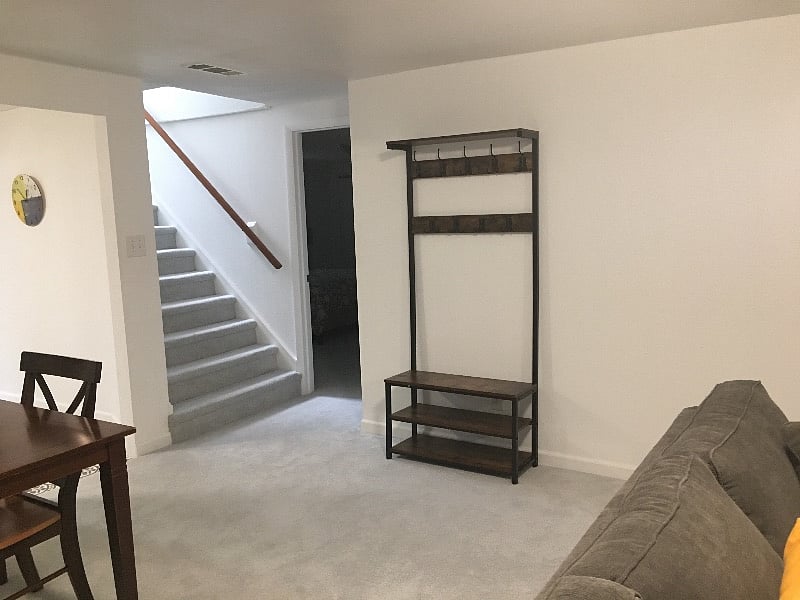 Hall tree with bench and shoe storage is conveniently located as you enter the apartment.