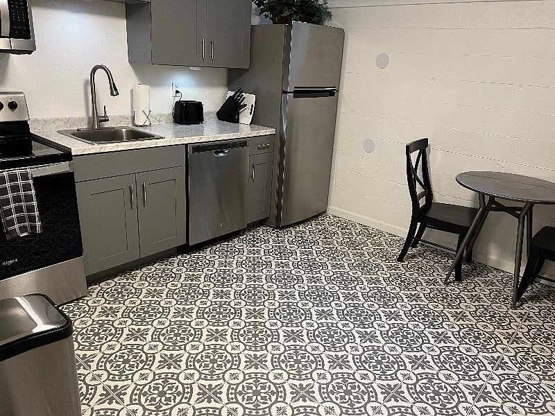 Spacious kitchen with table and chairs