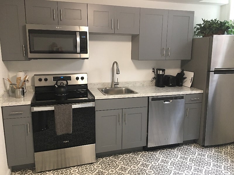 Fully equipped kitchen with matching Whirlpool stainless steel appliances. Dishes, coffee maker, toaster, and knives. Bake ware for cakes and cookies and stainless steel pots and pans. Deep stainless steel sink makes draining pasta easy.