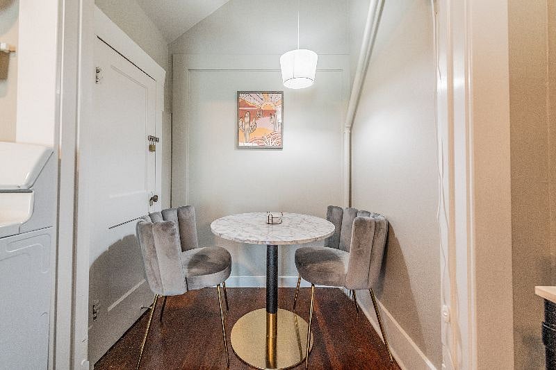 Breakfast nook with marbled table and plush cozy chairs