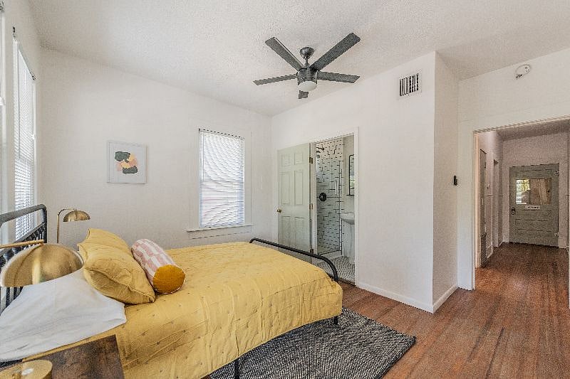 Queen bed with green tea infused memory foam mattress, view of ensuite bathroom