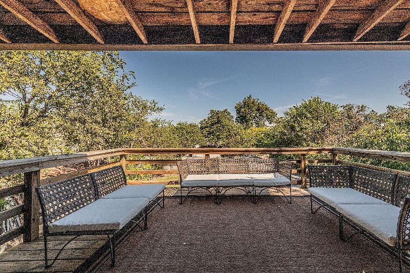 Back deck private seating area (lit by overhead strings of Edison bulbs overhead at nighttim)