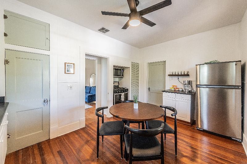 Kitchen with views of coffee/tea nook, new refrigerator and microwave/gas range
