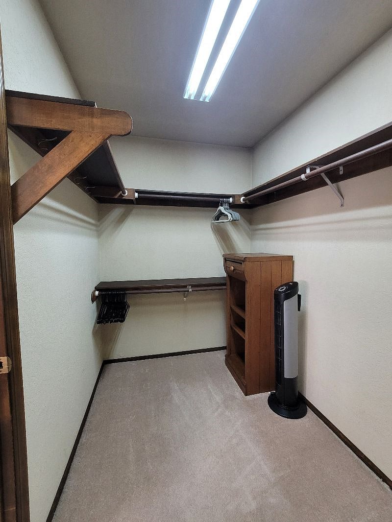 Walk in Closet. Extra fans & plenty of hangers.