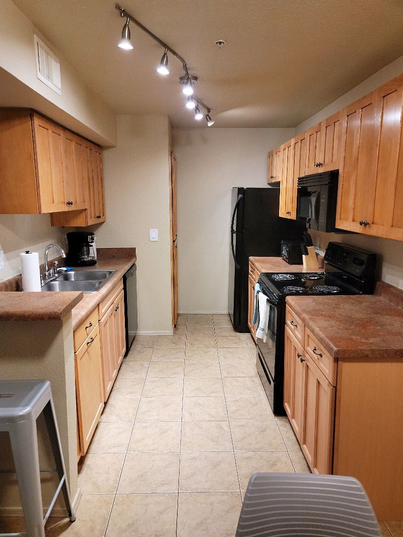 The kitchen - includes toaster oven, coffee maker, dishwasher, microwave and oven with cooktop