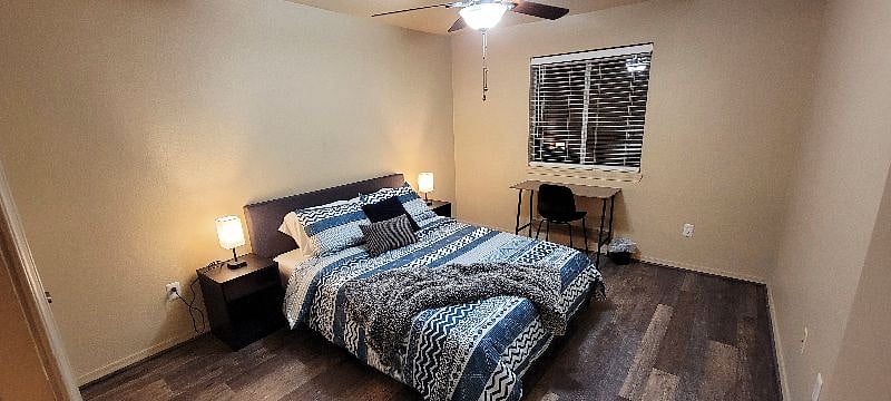 Your bedroom - features a queen bed, smart charging lamps, desk space, walk in closet.