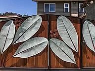 Attractive gate with keypad accessible door provides added privacy and security.