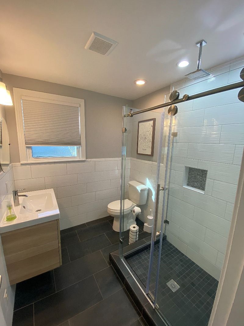 Hallway bathroom, fully stocked, with glassed-in rain shower!