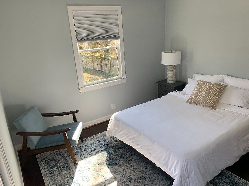 Bedroom 1:  Bright and spacious bedroom overlooking backyard.   Comfortable Queen-sized bed and light blocking shades for sleeping in!