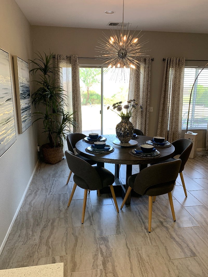 The large round Dinning room table easily seats six.