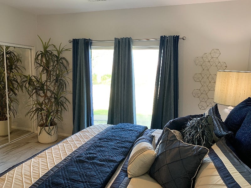 An amazing view from the primary bedroom looking out to the totally private backyard and out to the desert and mountains.