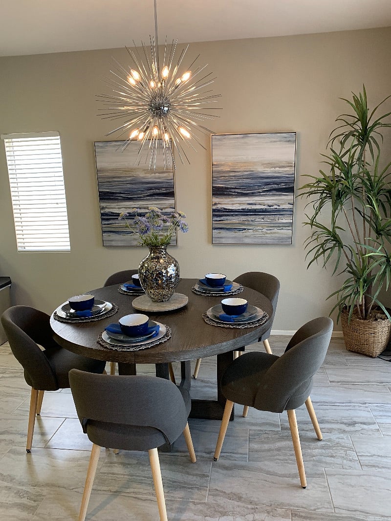The large round Dinning table seats six comfortably. (Shown set for 5)