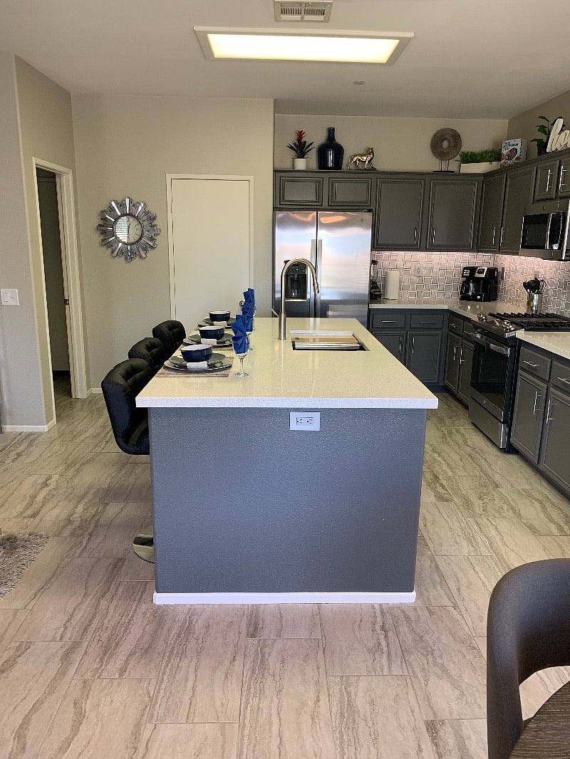 The same high quality Porcelain tile floors run throughout the entire home.
Solid quartz countertops, not tile.