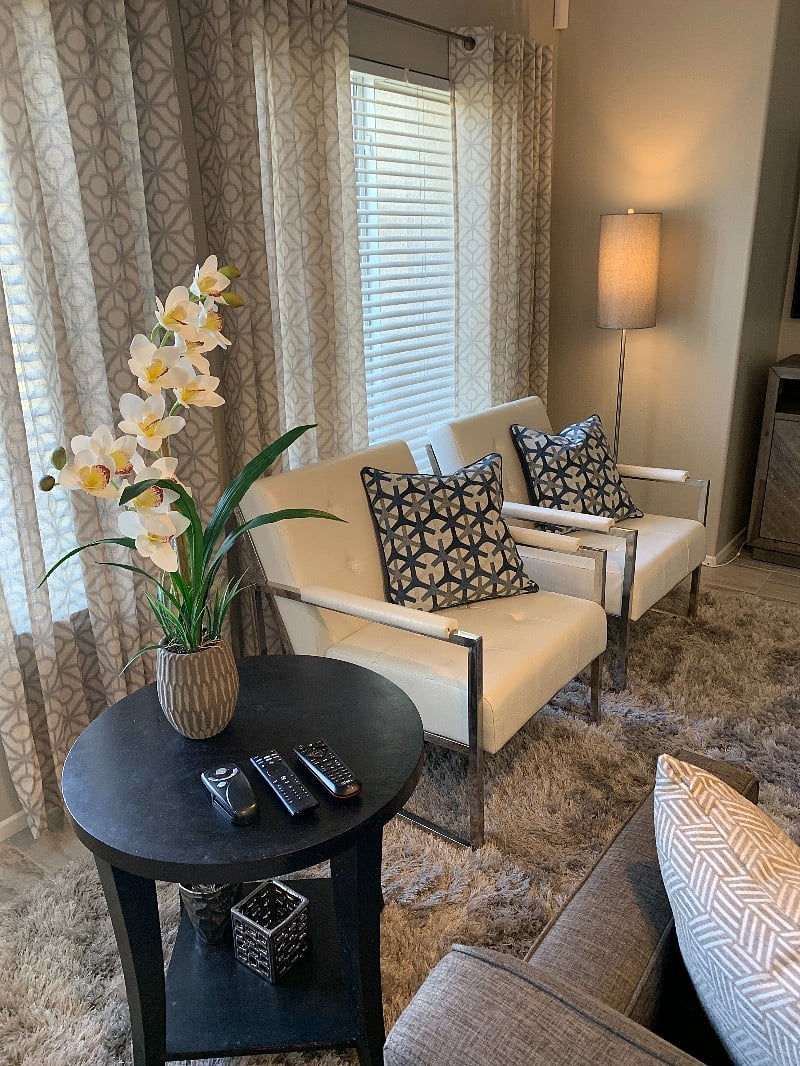 White leather chairs sit on the plushest of shag rugs.
Luxury textures upon textures separate this home from the competition and anything costing $$$ more.