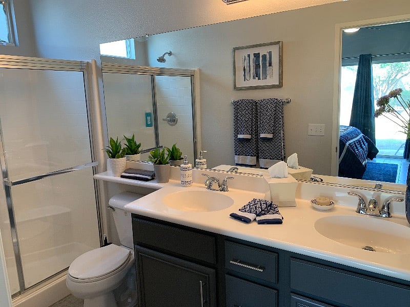 Double sinks in the primary, en suite bathroom.