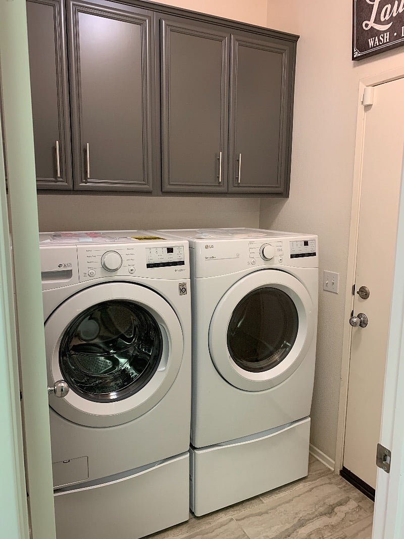 Brand new washer and dryer on platforms make doing laundry a breeze.