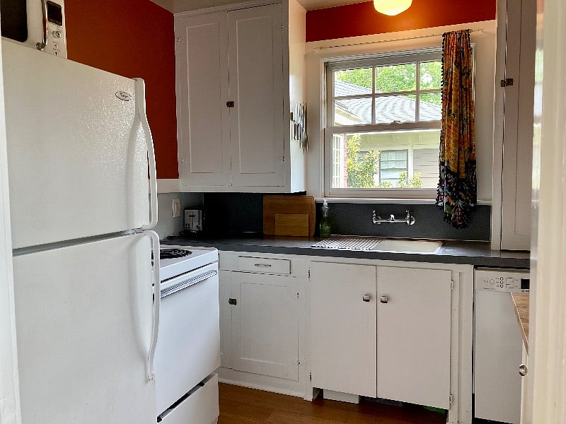 Full kitchen with pots, pans, dishes, flatware, dishwasher, microwave, coffee maker and plenty of storage