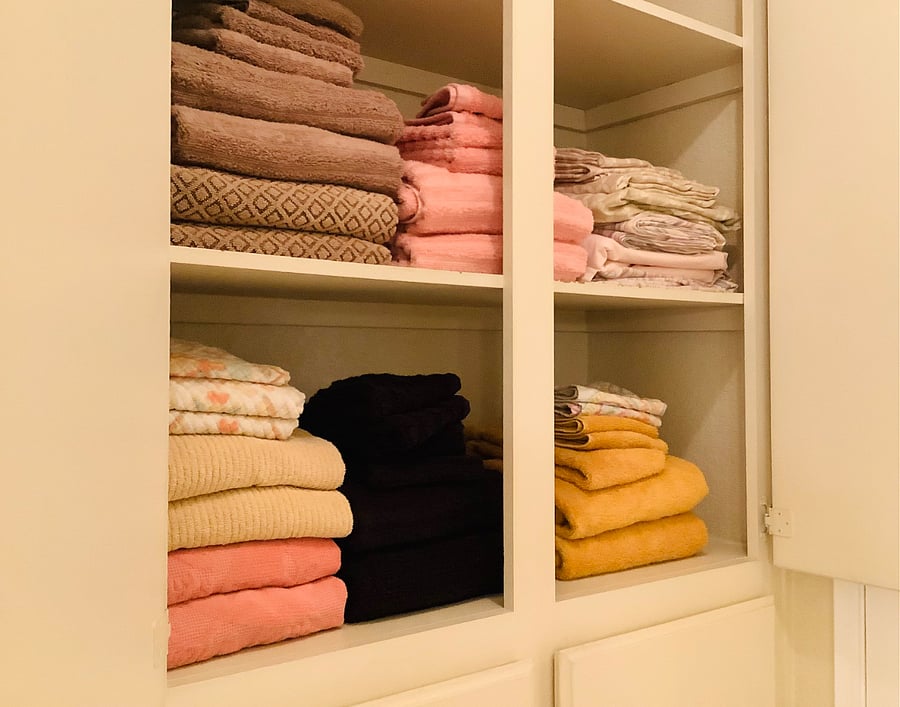 Linen closet storage floor to ceiling.