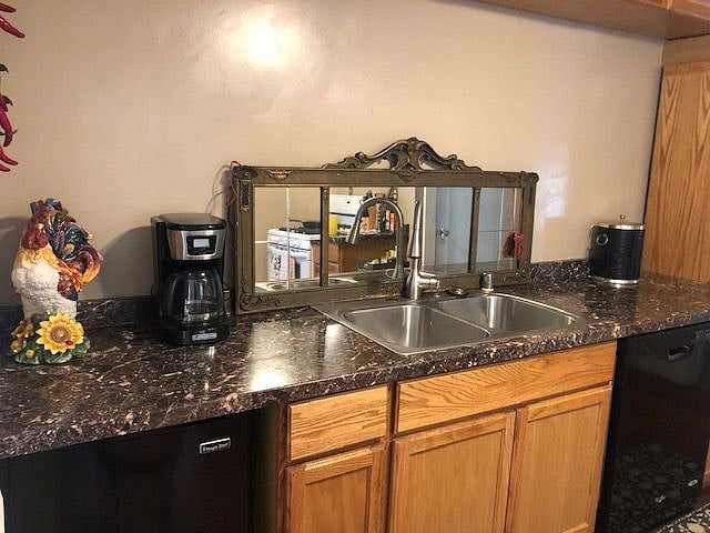 Mini-fridge located at left of sink. Automatic Dishwasher on the right. A portable microwave (in the basement) can be put here for the frequent users ;)  A full-size fridge with freezer is also located in the basement, next to the washer and dryer.