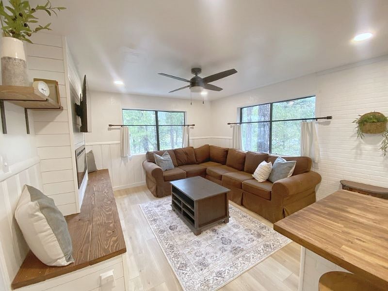 Comfortable couch, coffee table and lovely fireplace/tv area