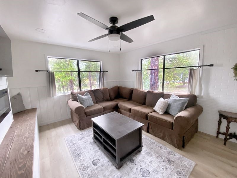 Comfy sectional and cafe curtains for wonderful views, with privacy