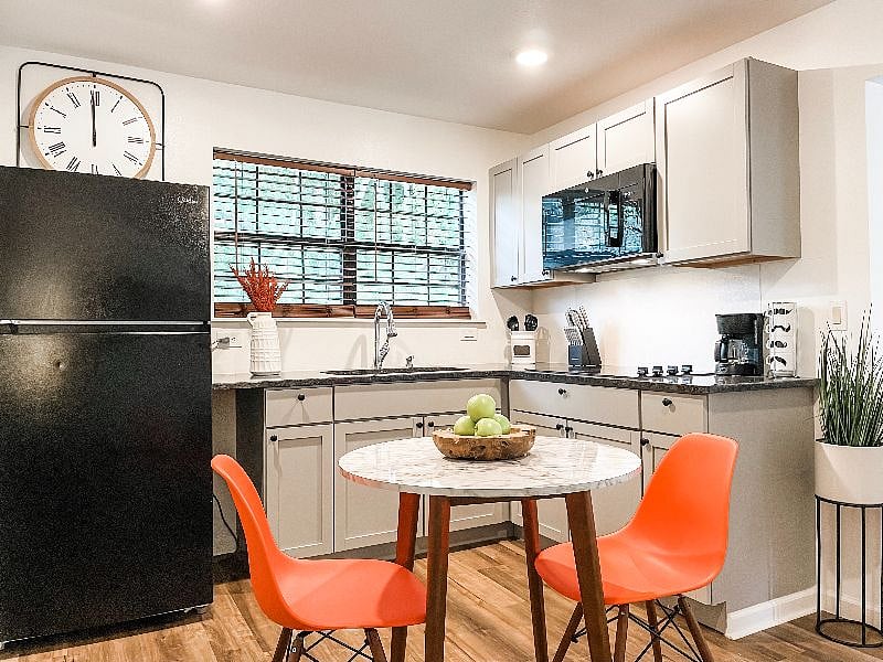 Full kitchen with cooktop and microwave.