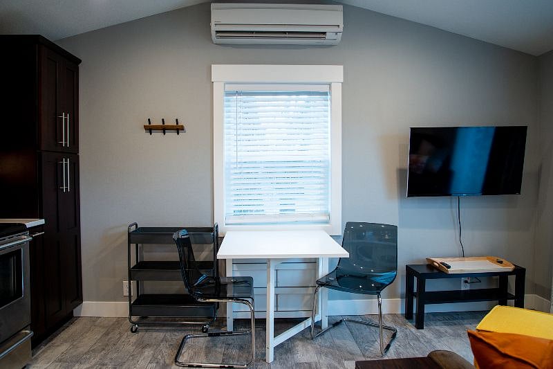 Table folds down for extra floor space.