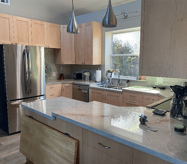 Kitchen area facing toward bedroom.