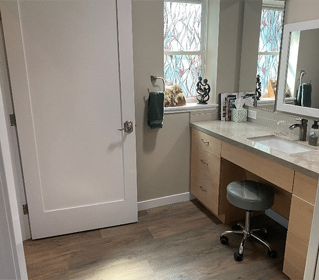 Bathroom vanity area with medicine cabinets and custom cabinets.