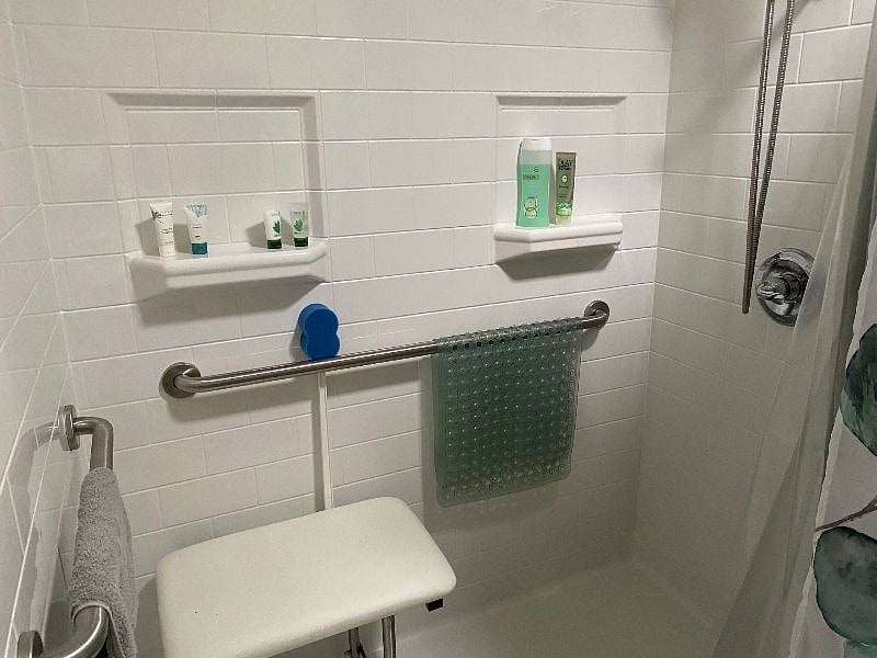 Easy-care shower with accessibility features.