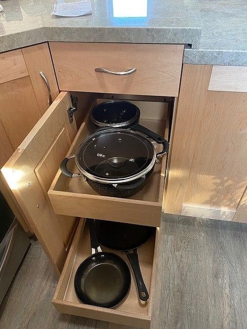 Pots, pans and lids in easy-access pull-out drawers.