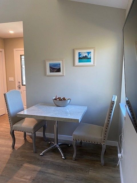 Dining area with table & 2 chairs.