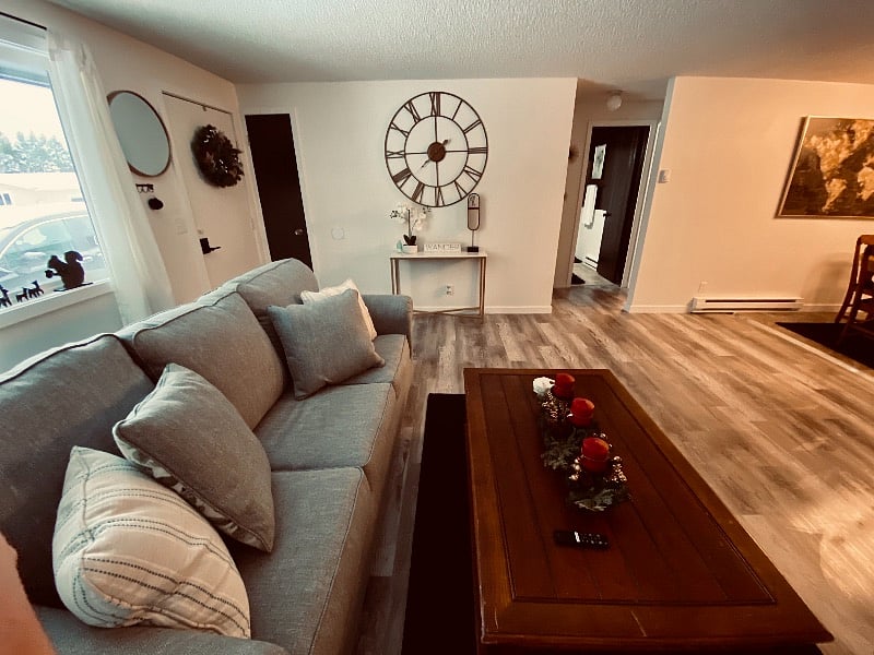 Standing in living room, looking to hallway where bathroom and bedrooms are located.