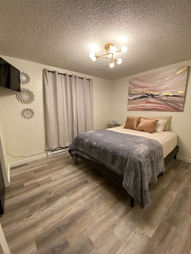 Queen bedroom. Smart TV, closet, and drawers. Additional dressers can be added if requested.