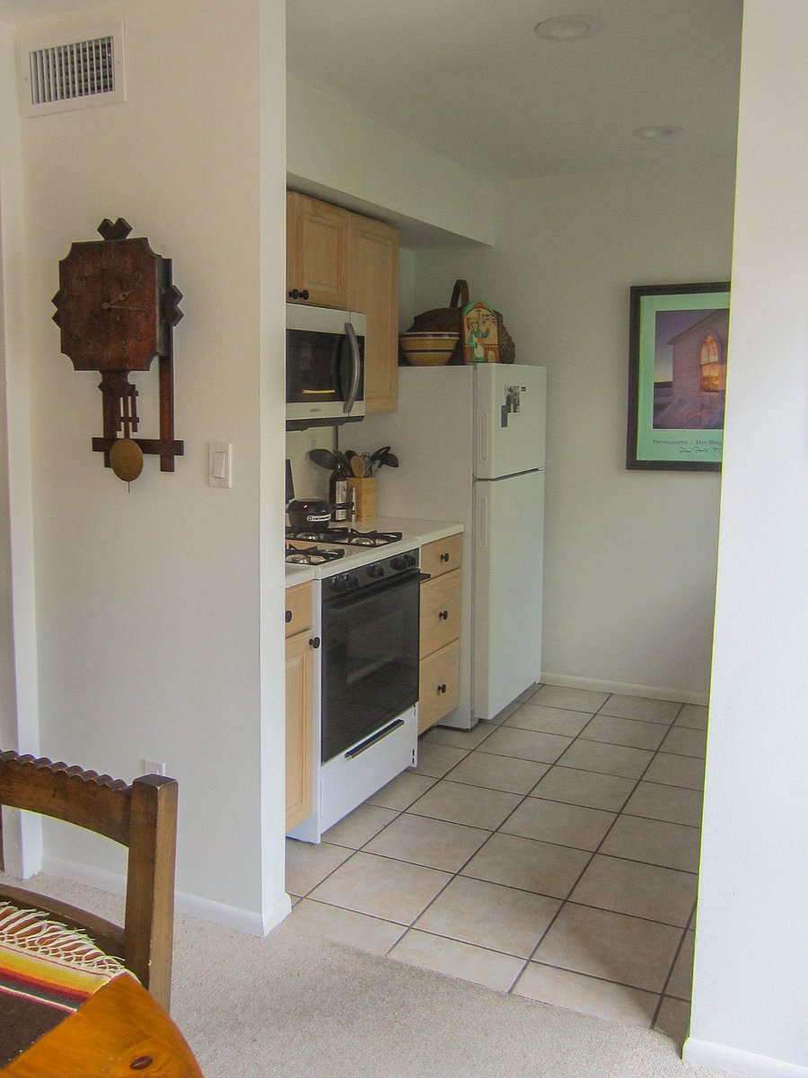 Spacious Galley Kitchen With Gas Stove and Microwave