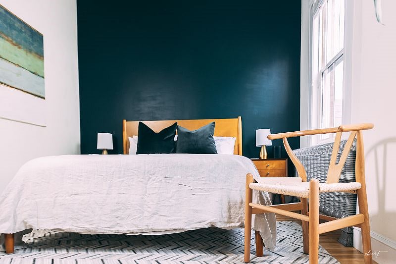 Secondary bedroom with a queen bedroom and office area