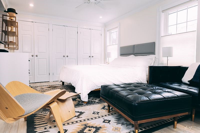 Primary bedroom with king size bed and generous storage closets