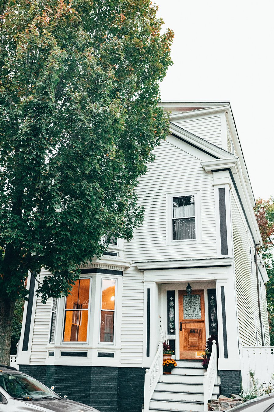 Historic greek-revival building on a tree-lined street