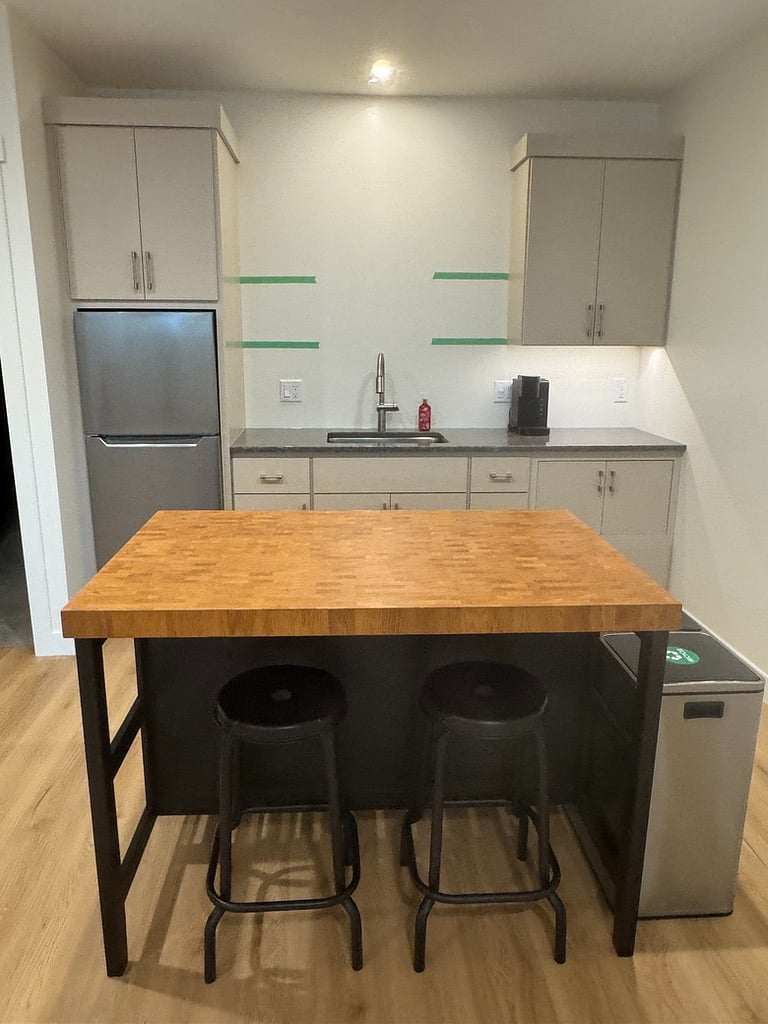 Your own kitchenette with refrigerator/freezer, microwave/oven/air fryer, keurig and fully stocked with plates, glassware, utensils, storage containers and cooking equipment.