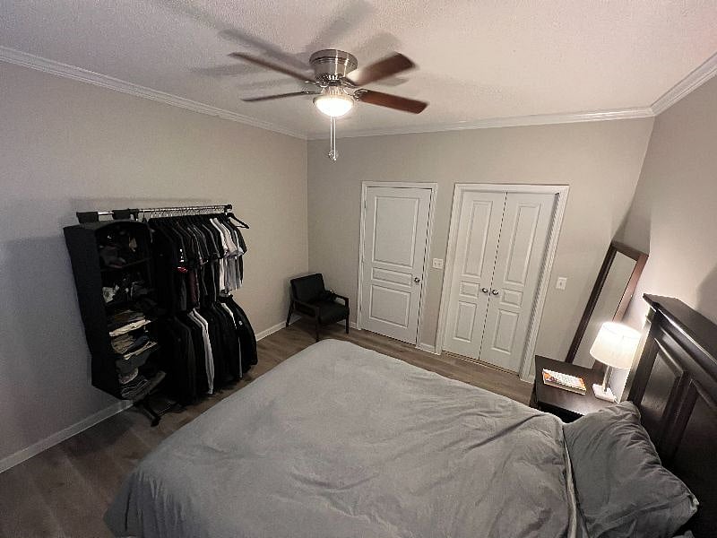 Main bedroom is spacious and has plenty of space for storage.